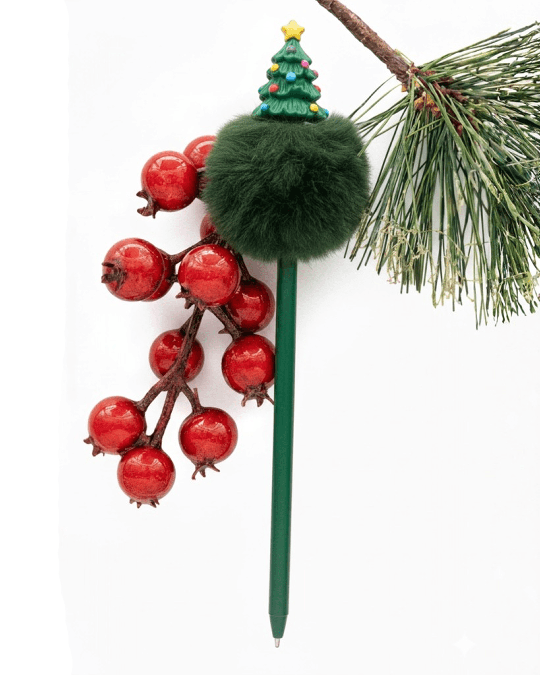A set of novelty Christmas pens featuring character toppers like Santa, reindeer, and snowmen, displayed in a holder or arranged on a desk.