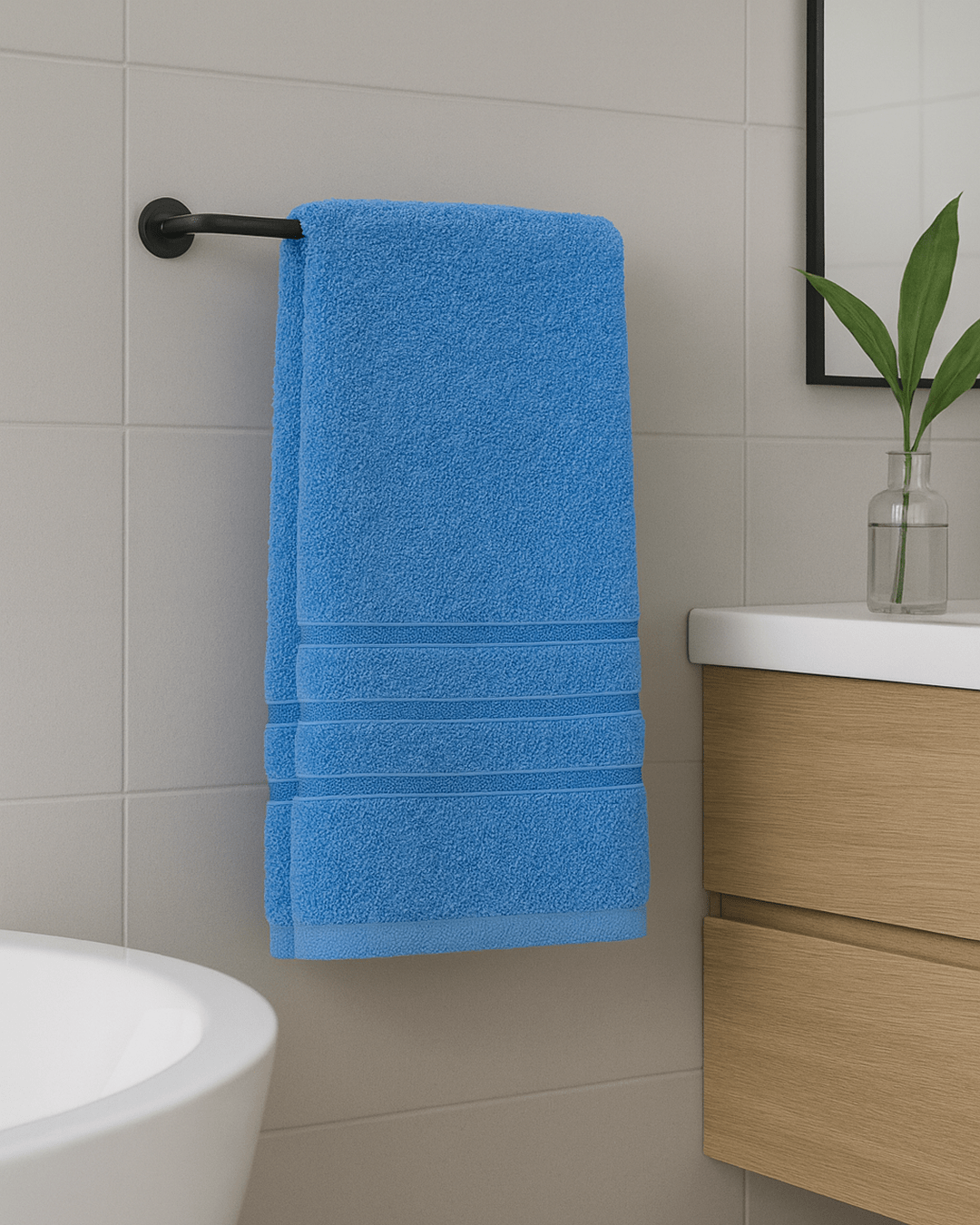Folded 50x90 cm hand and face towels made from 100% Turkish cotton, soft and absorbent bathroom textiles in neutral tones.