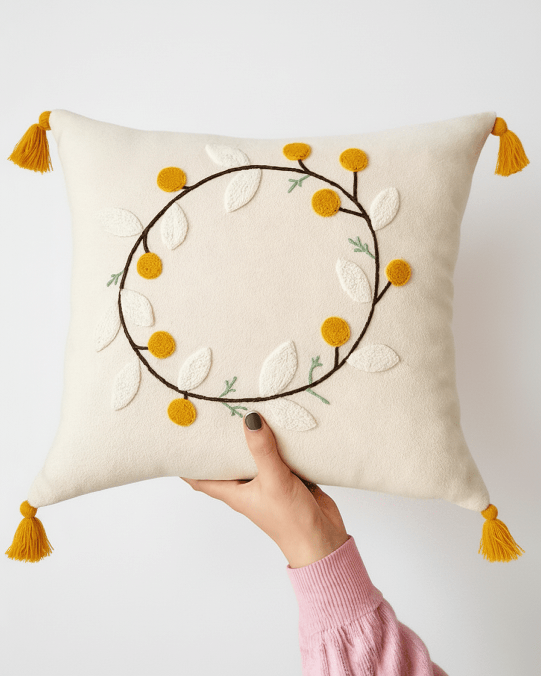 Punch needle decorative cushion with textured tufted design displayed on a modern sofa, neutral cozy home interior styling.