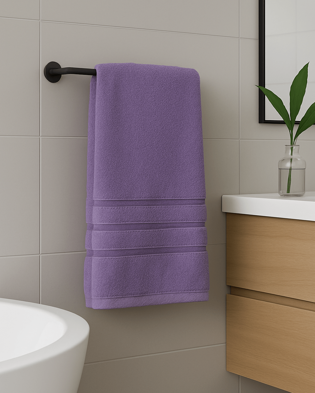 Folded 50x90 cm hand and face towels made from 100% Turkish cotton, soft and absorbent bathroom textiles in neutral tones.