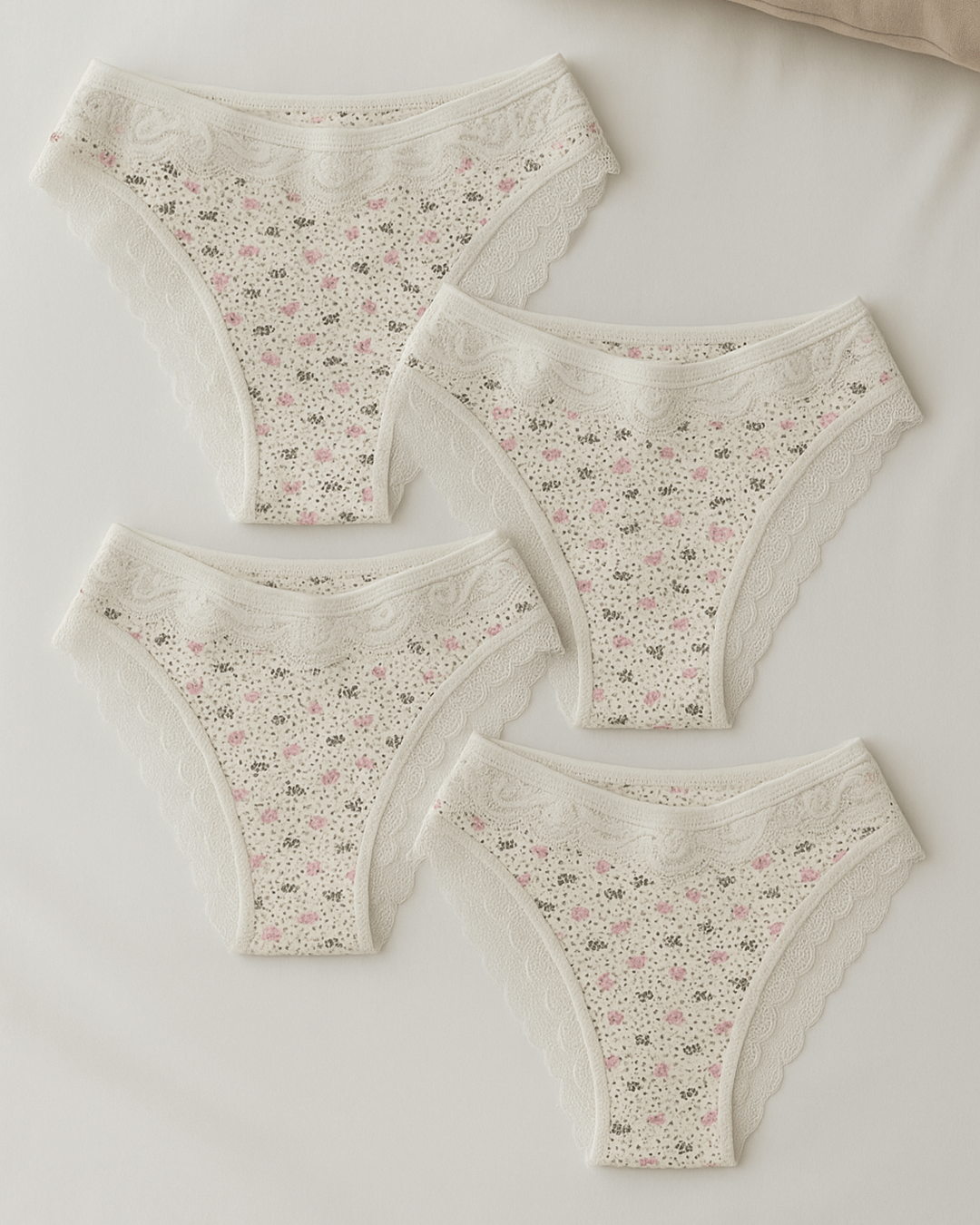 Women’s underwear with thick supportive fabric and delicate lace edges, displayed flat in soft neutral tones for everyday comfort and feminine style.